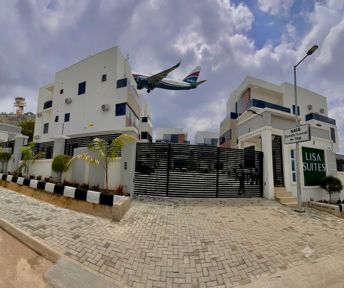 Safe hotels in Abuja gated entrance with 24-hour security staff"]